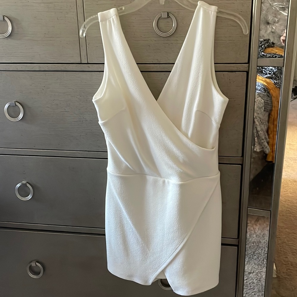 Brand NEW White, short, dress w/shorts underneath. Size Large.
